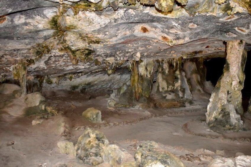 A cave interior with stalactites and stalagmites. 2