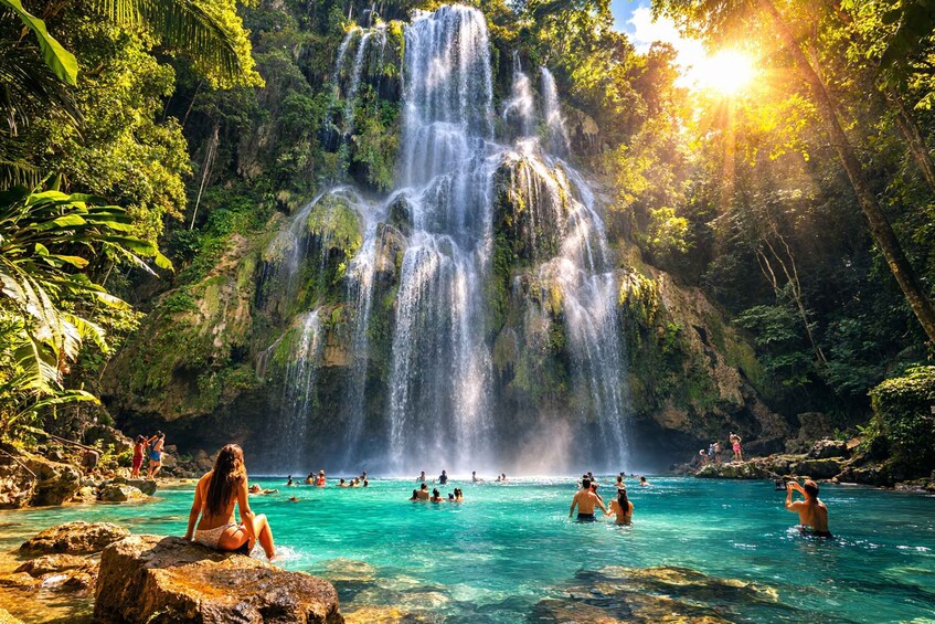 A waterfall cascading into a clear pool surrounded by lush greenery. 3