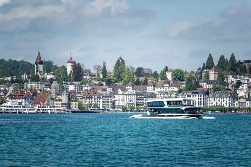 A cityscape with a river, a boat, and historic towers. 4