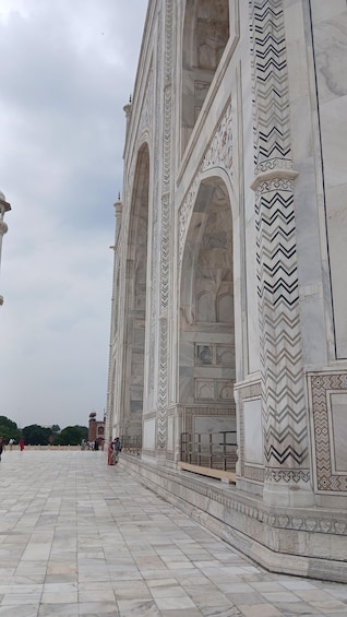 A large marble building with intricate carvings and arches. 3
