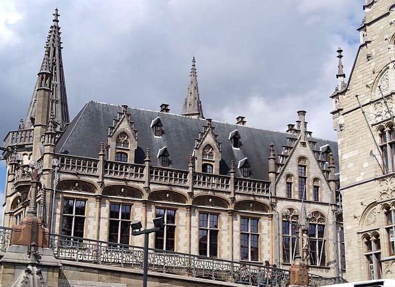 A historic building with ornate Gothic architecture, including pointed arches and intricate stonework. 2