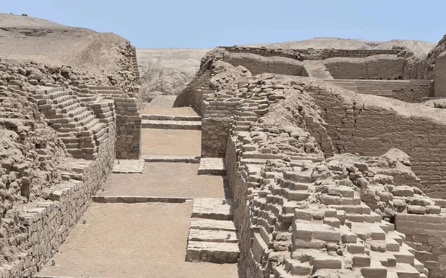 Ancient brick structures with a central pathway. 2