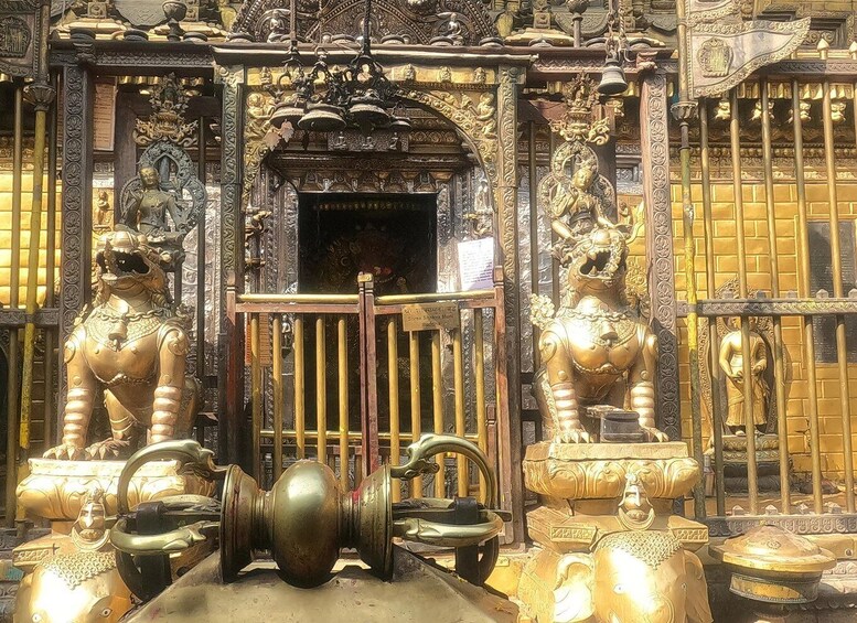 Ornate golden statues and intricate architectural details of a temple. 4