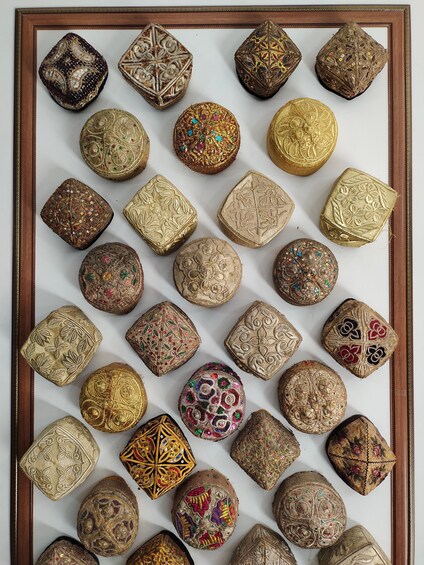 A collection of intricately decorated wooden boxes and artifacts. 5