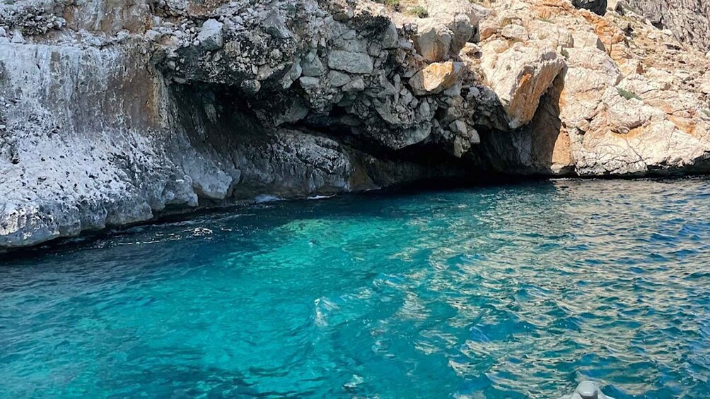 A rocky coastline with clear turquoise water. 2