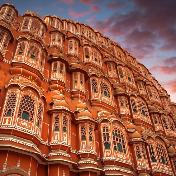 A large, ornate building with intricate architectural details and multiple windows. 3