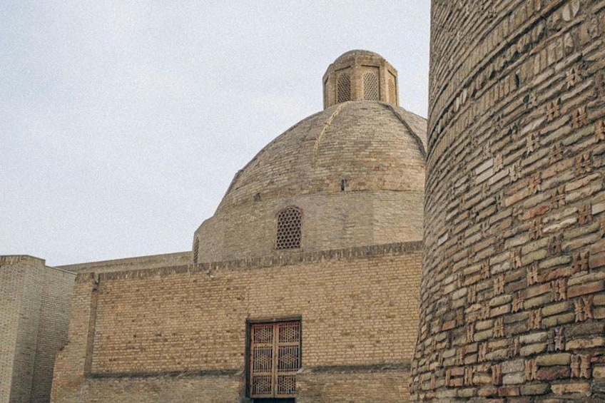 A historic building with a large dome and a minaret. 4