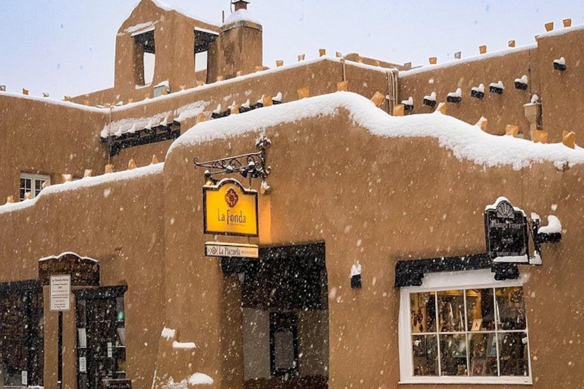 A snow-covered building with a sign reading 'La Jondia.' 3
