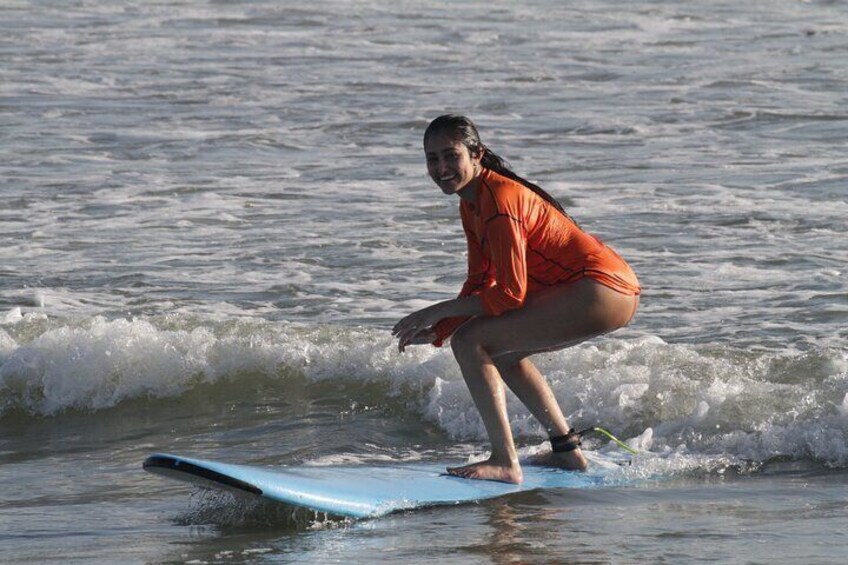 A person surfing on a wave in the ocean. 2