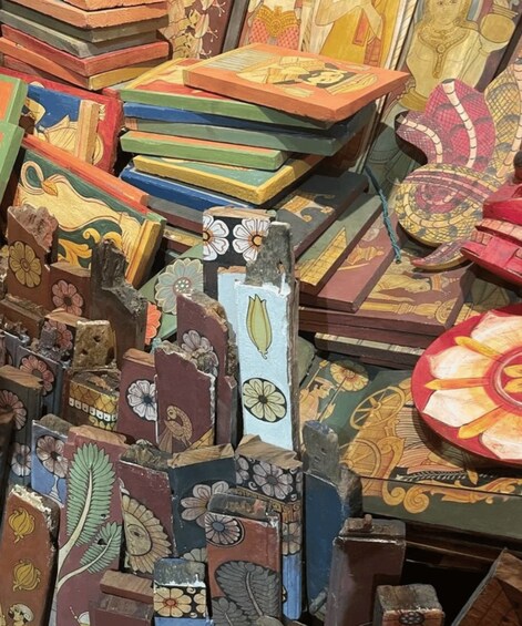 A collection of intricately designed wooden blocks with floral and geometric patterns. 4
