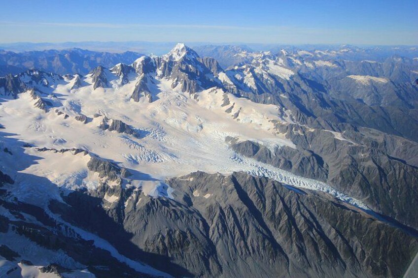 A glacier in a mountainous region. 3