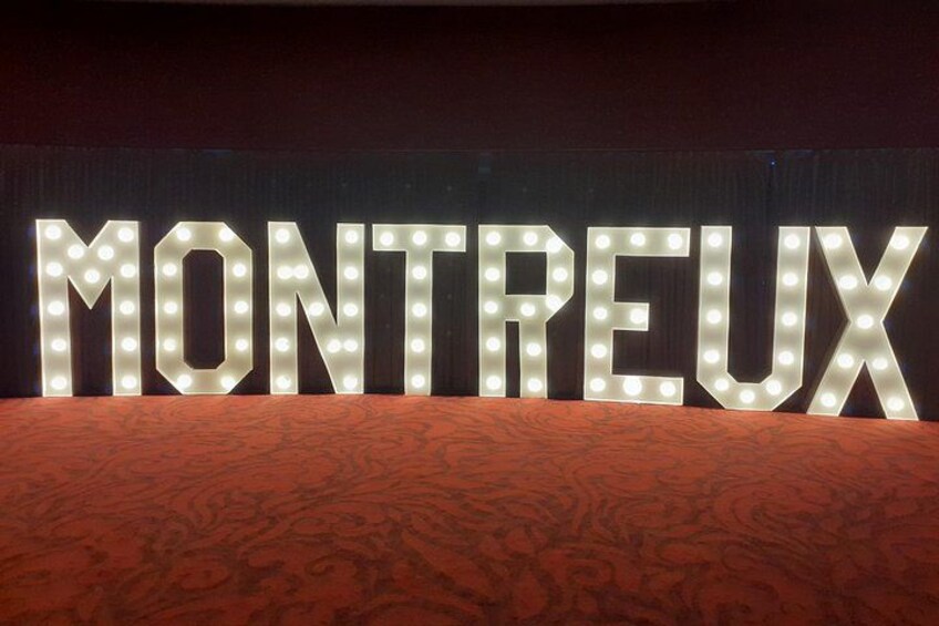 Illuminated letters spelling 'MONTREUX' on a backdrop. 4