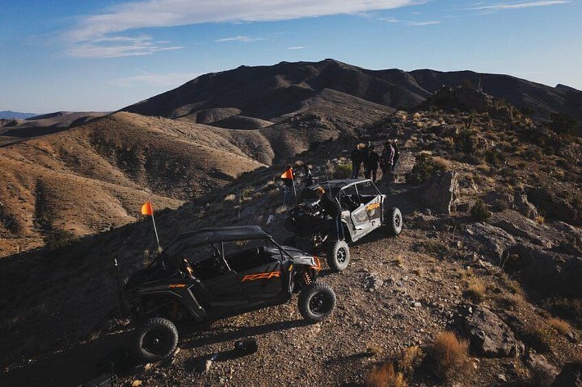 Off-road vehicles on a rocky terrain with flags. 2