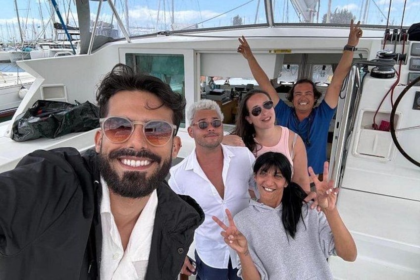 A group of people on a boat with a marina in the background. 3