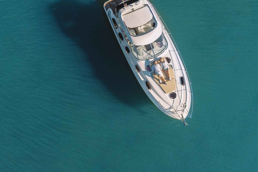 An aerial view of a yacht on turquoise water. 5
