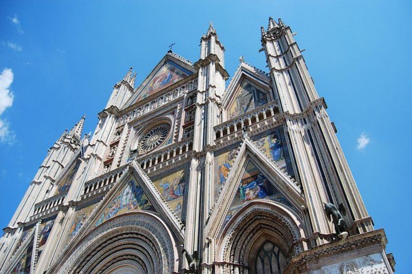 A Gothic cathedral with intricate stained glass windows and a large rose window. 4