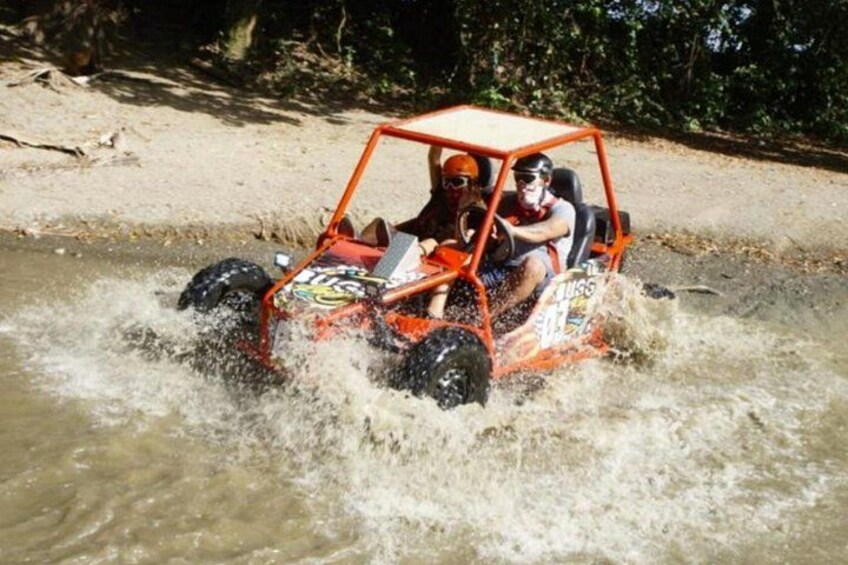 A vehicle driving through water. 4