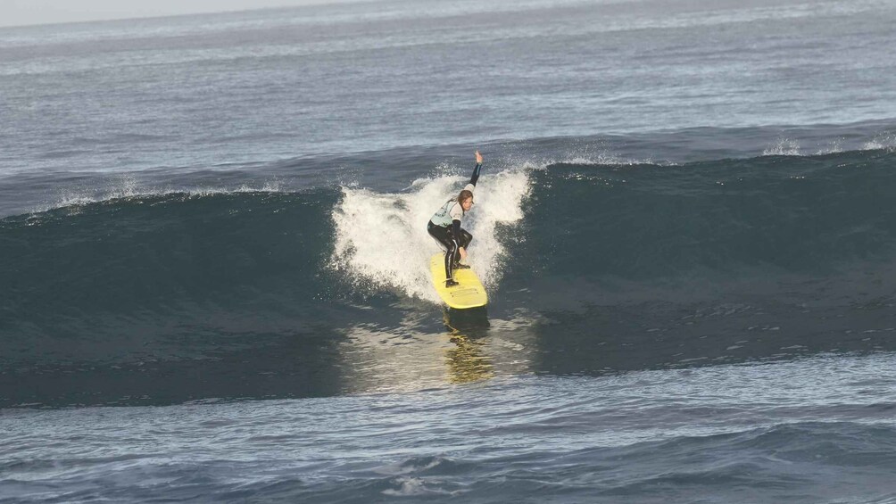 A surfer riding a wave in the ocean. 3
