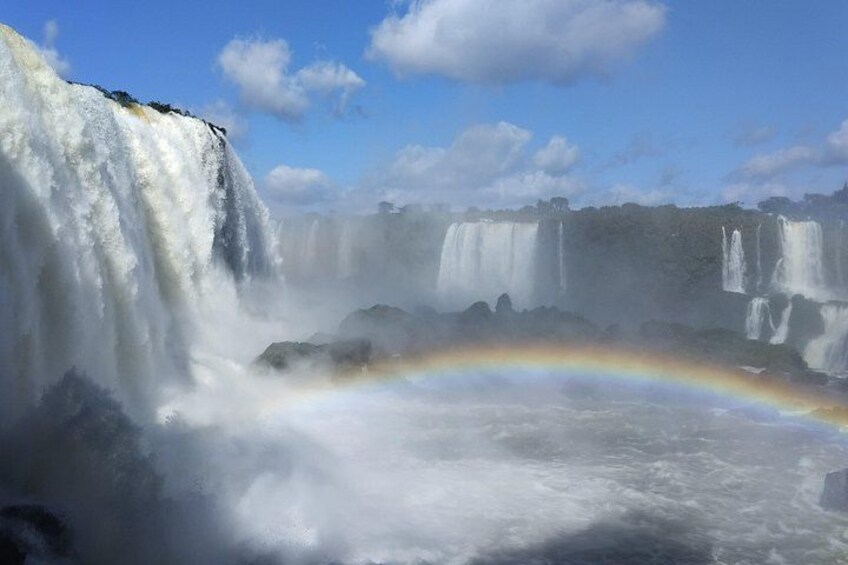 A waterfall with a rainbow. 5