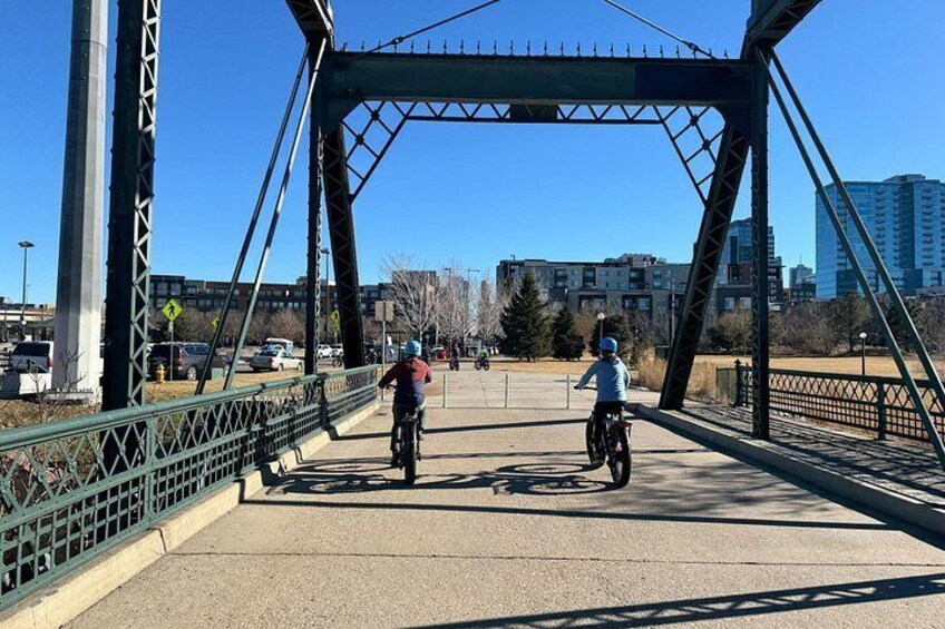 Our blue E-Bikes along the bridge near commons park 4