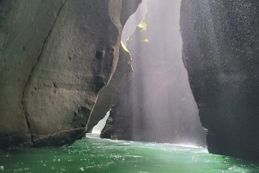 A cave with water flowing through it. 5