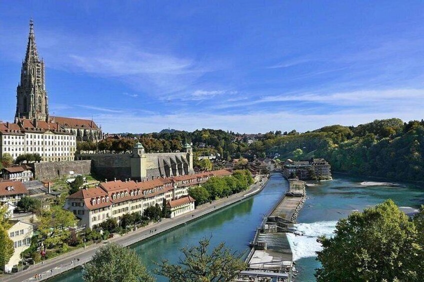 A river with a bridge, a cathedral, and a castle. 4