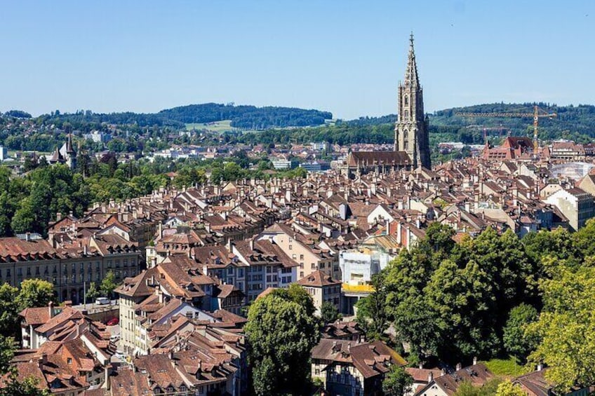 A cityscape with a prominent cathedral and dense urban buildings. 3