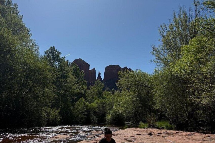 A river, trees, and rock formations. 2