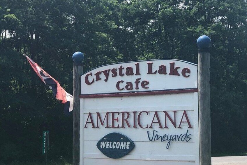 A sign for Crystal Lake Cafe with 'AMERICANA Vineyards' and 'WELCOME' written on it. 3