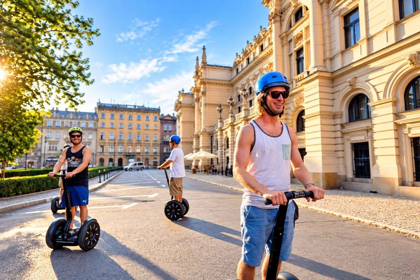 Three people riding segways on a cobblestone street with historic buildings in the background. 5