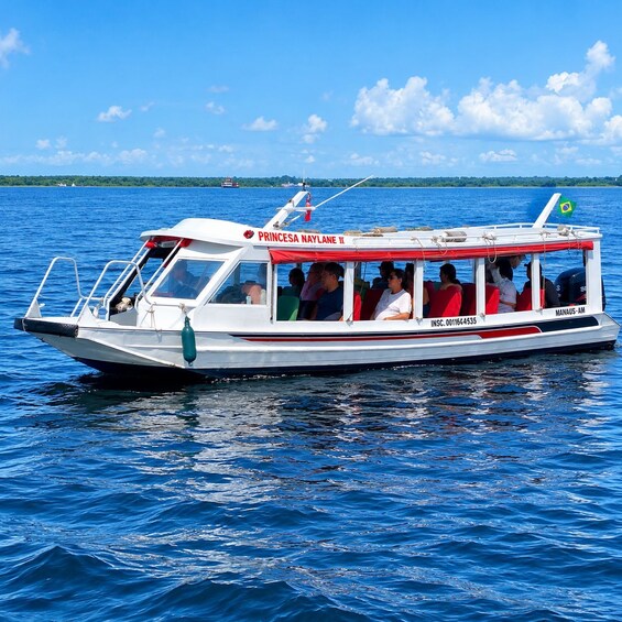 A boat named PRINCESA NAYLANE II on a calm blue sea with passengers. 5
