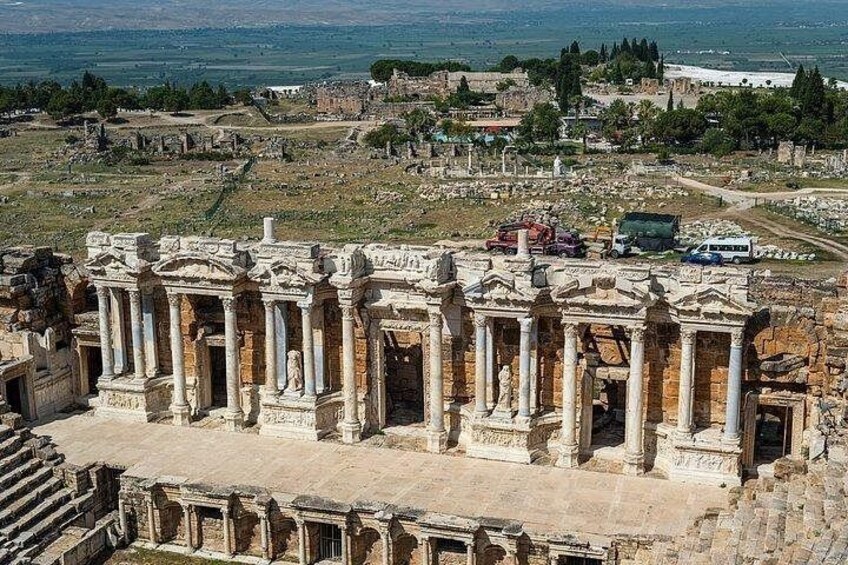 Ancient ruins with columns and a view of the surrounding landscape. 2