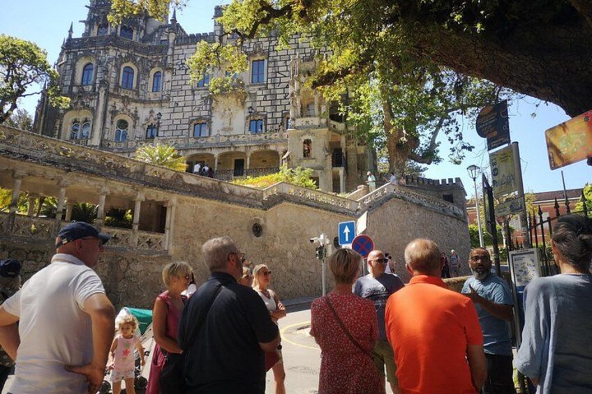 A historic building with tourists. 3