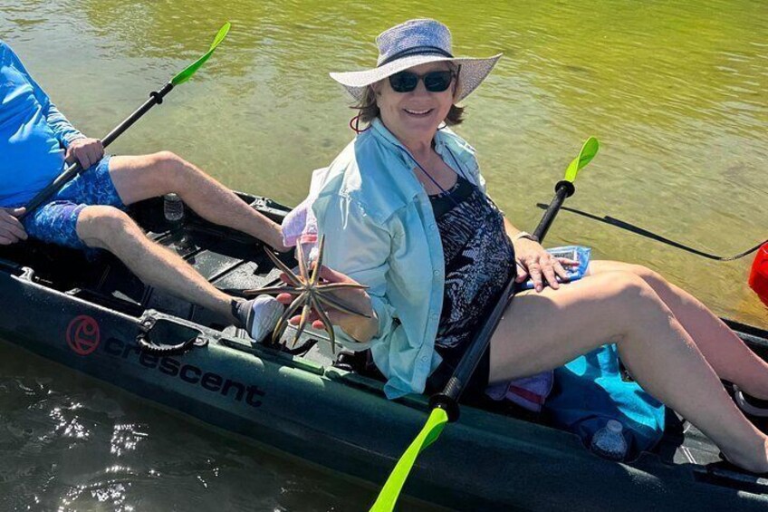 Two people in a canoe on a body of water. 3