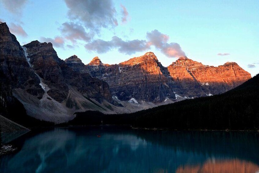 A mountain range with a lake reflecting the peaks. 3