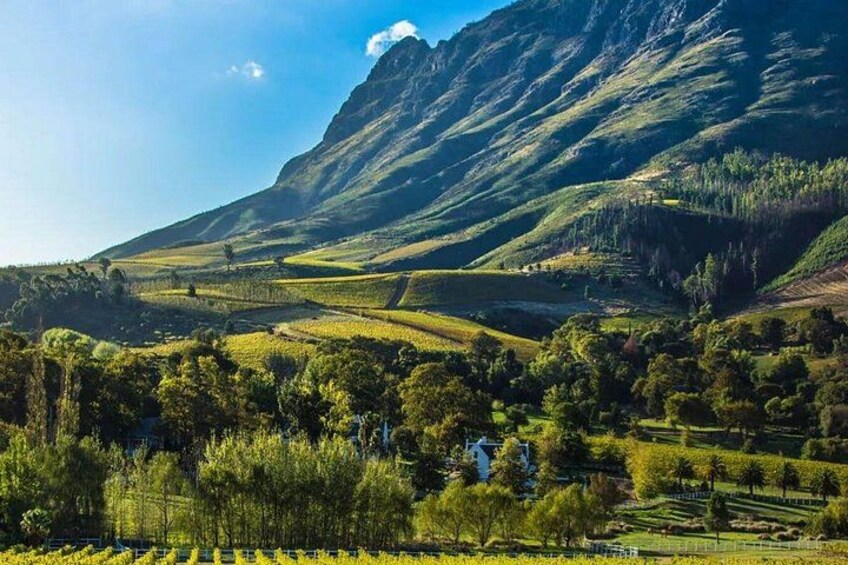 A mountainous landscape with terraced fields and a clear sky. 3