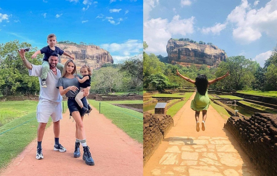 A family walking on a path with a large rock formation in the background. 1