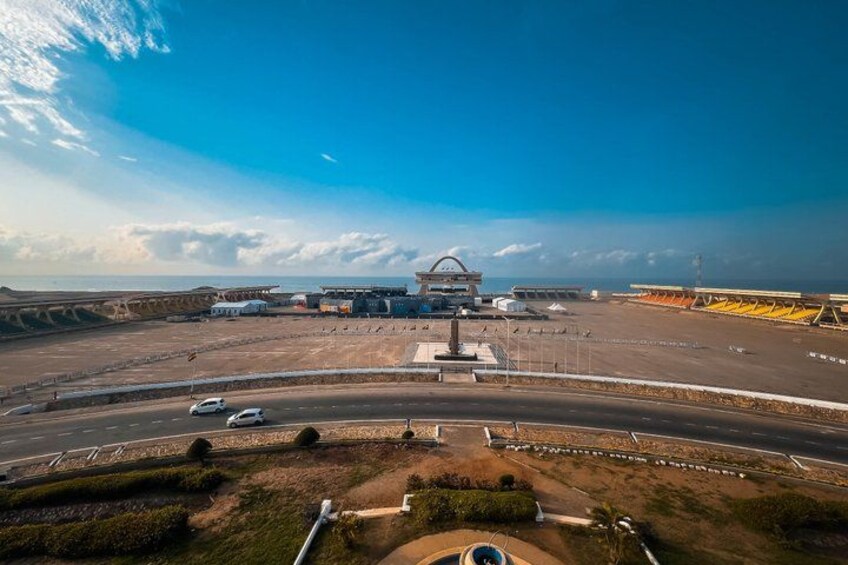 An airport with a control tower, tarmac, and parked aircraft. 4