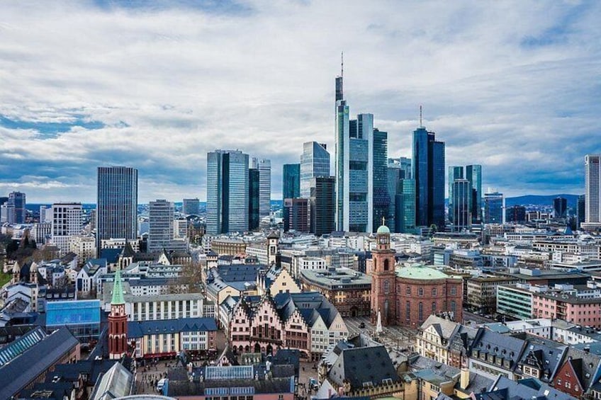 A cityscape with modern skyscrapers and historic buildings. 3
