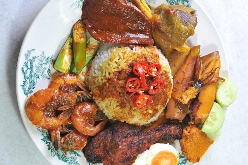 A plate of food with rice, shrimp, and various vegetables. 4