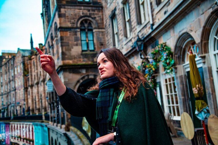 A person taking a selfie with a historic building in the background. 1