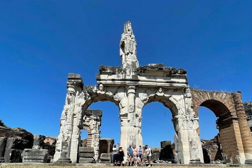 Ancient stone ruins with arches and columns, likely a historical site. 1
