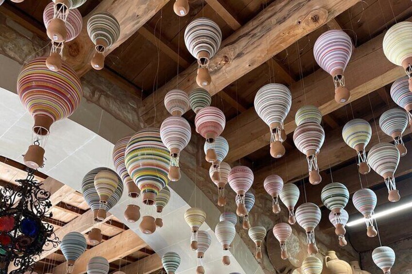 A ceiling with multiple hanging lanterns. 1
