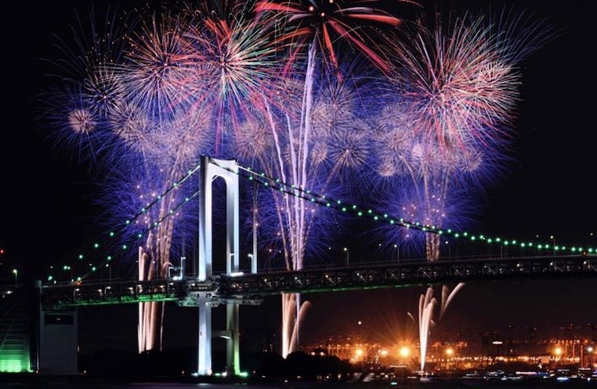 A bridge with fireworks in the background. 2