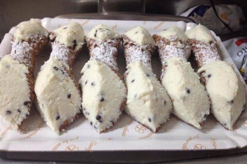 A tray of ice cream cones with chocolate chips. 2