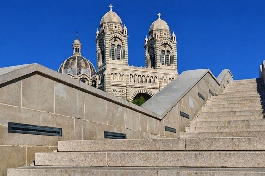 A church with two domes and a clock tower. 5