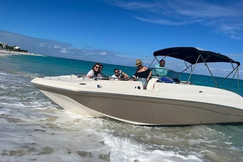 A boat with people on a beach. 5