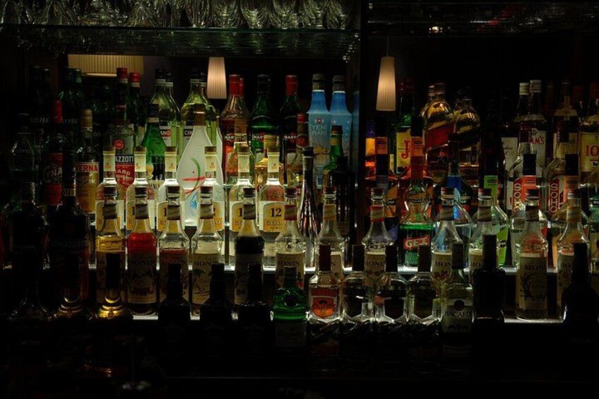 A bar with various bottles of alcohol. 2