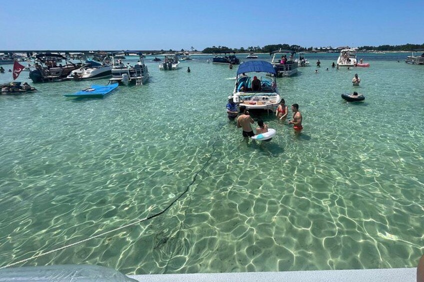 A marina with boats and people in the water. 3