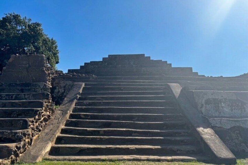 A set of ancient stone steps leading up to a platform. 3
